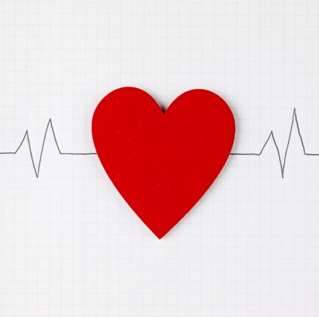 Vertical,Image,Of,Red,Heart,And,Heart,Rate,On,White
